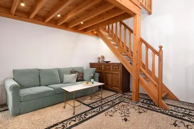 a living room with a couch and a staircase at Villa Lindia in Líndos
