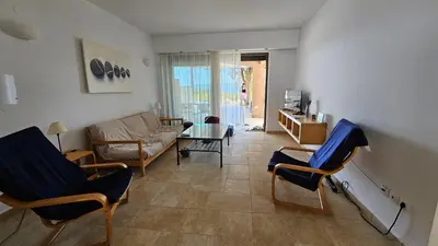 a living room with chairs and a couch at Pefkos Beachfront Villa in Pefki Rhodes