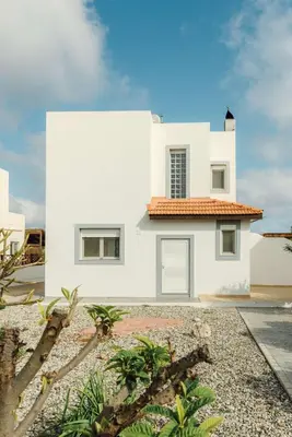 a white house with a red roof at Gennadi Dreams Holiday Villa in Gennadi