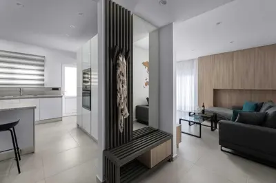 a living room and kitchen with a couch and a table at Kallia Sea Breeze - 3 Bedroom Apartment in Rhodes Town