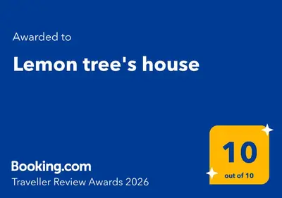 a yellow sign that reads lemon trees house at Lemon tree's house in Kalavárda