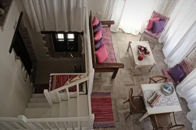 an overhead view of a staircase in a living room at Muse Neate in Halki