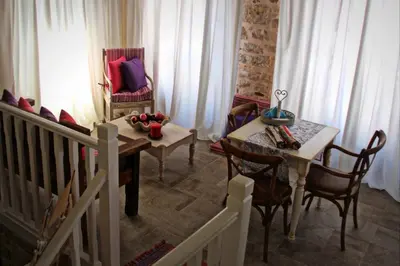 a dining room with a table and chairs at Muse Neate in Halki
