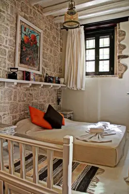 a bedroom with a large bed in a room at Muse Mese in Halki