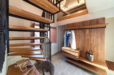 a staircase in a room with wooden walls at Anastasia Grand Villa in Kattavía