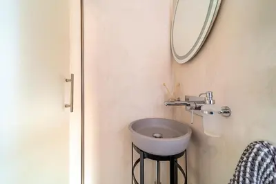 a bathroom with a sink and a mirror at Anastasia Grand Villa in Kattavía