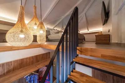 a staircase in a house with pendant lights at Anastasia Grand Villa in Kattavía