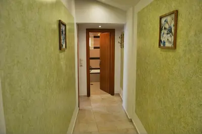 a hallway with green walls and a hallway with a door at Casa DimiGre house in Kattavia - Prasonisi Rhodes in Kattavía