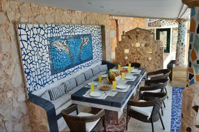 a dining room with a long table and chairs at Casa DimiGre house in Kattavia - Prasonisi Rhodes in Kattavía