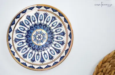a blue and white plate on a wall at Casa terrazzo in Paradeísion