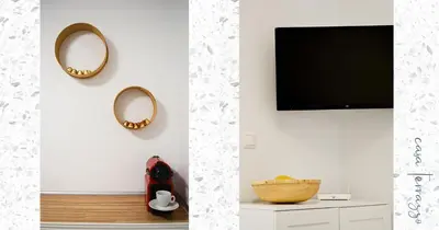 a living room with a tv and a mirror at Casa terrazzo in Paradeísion