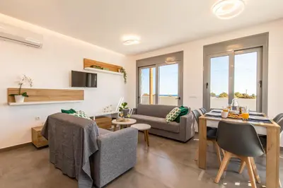a living room with a couch and a table at Dorieus Villa in Lachania