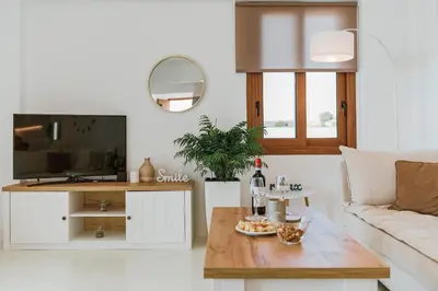 a living room with a couch and a table at Villa Oriens in Gennadi
