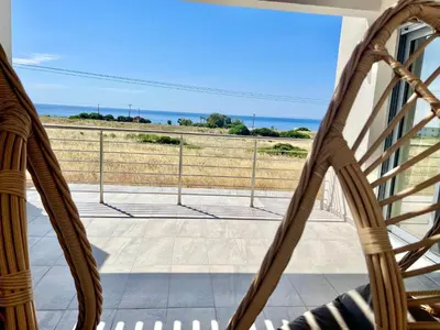a balcony with a view of the ocean at Kallipateira Villa in Lachania