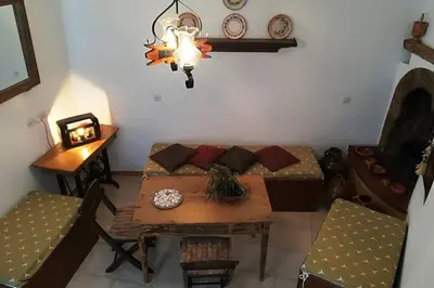 a living room with a table and a couch at Jimmy΄s Place in Gennadi