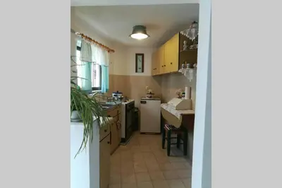 a kitchen with a sink and a counter top at Jimmy΄s Place in Gennadi
