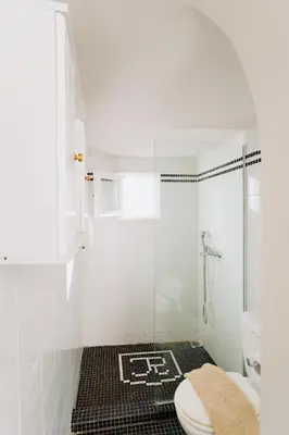 a white bathroom with a shower and a toilet at Rhodes Old town apartment manos in Rhodes Town