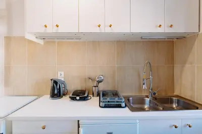 a kitchen counter top with a sink and a sink at Rhodes Old town apartment manos in Rhodes Town