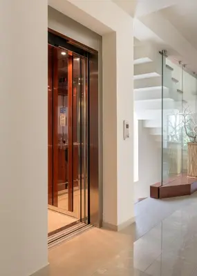 a hallway with glass doors and a staircase at Ixian Hilltop Villa in Triánta