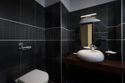 a bathroom with a sink and a toilet and a mirror at Ixian Hilltop Villa in Triánta