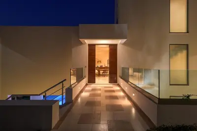 a hallway of a house at night at Ixian Hilltop Villa in Triánta