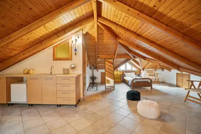 a large room with a ceiling with wooden beams at Villa Del Mar in Ialyssos