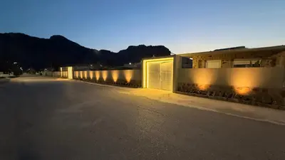 an empty street with a row of buildings with lights at LA Casa Di Lusso N7 -Adults Only in Kolimbia