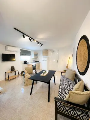 a living room with a couch and a table at LA Casa Di Lusso N7 -Adults Only in Kolimbia
