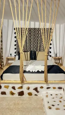 a bedroom with a bed with hanging ropes at LA Casa Di Lusso N7 -Adults Only in Kolimbia