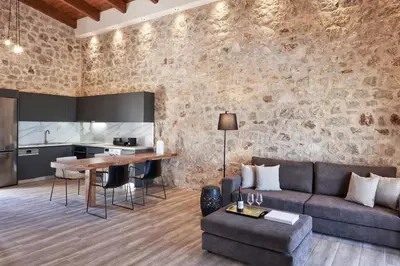a living room with a couch and a table at Anar Villas Rhodes in Koskinou