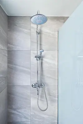 a shower in a bathroom with a glass wall at Anar Villas Rhodes in Koskinou