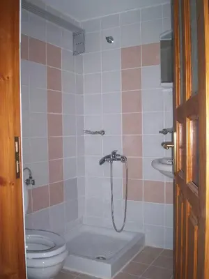 a bathroom with a shower and a toilet at Old House in Paradeísion