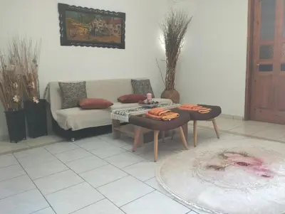a living room with a couch and a table at Old House in Paradeísion