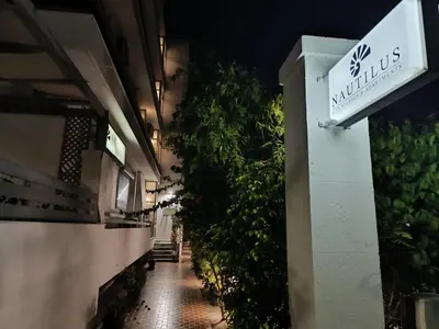 an alley with a sign on the side of a building at Nautilus City Studios & Apartments in Rhodes Town