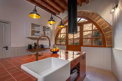a kitchen with a sink and an arch window at Casa Della vita Suite ,Old Town Rhodes in Rhodes Town