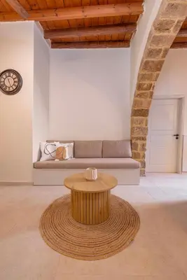 a living room with a couch and a table at Casa Della vita Suite ,Old Town Rhodes in Rhodes Town
