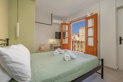 a bedroom with a bed with towels on it at Casa Della vita Loft ,Rhodes Old town in Rhodes Town