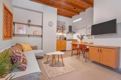 a living room with a couch and a table at Casa Della vita apartment ,Old Town Rhodes in Rhodes Town