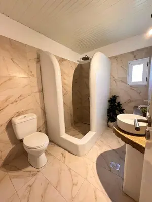 a bathroom with a toilet and a sink at LA Casa Di Lusso Grande Casa -Adults Only in Kolimbia