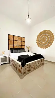 a bedroom with a large bed and a large mirror at LA Casa Di Lusso Grande Casa -Adults Only in Kolimbia