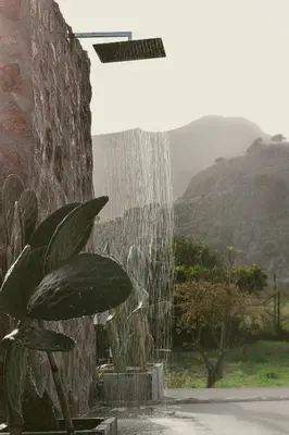 a water fountain with a plant in front of it at LA Casa Di Lusso Grande Casa -Adults Only in Kolimbia