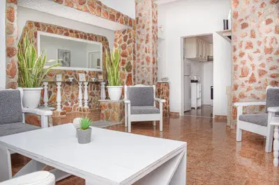 a living room with a white table and chairs at LA Casa Di Lusso Grande Casa -Adults Only in Kolimbia