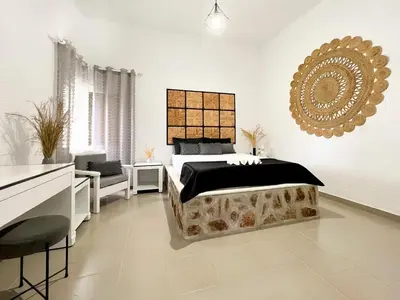 a bedroom with a bed and a mirror on the wall at LA Casa Di Lusso Grande Casa -Adults Only in Kolimbia