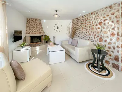 a living room with a couch and a fireplace at LA Casa Di Lusso N6 -Adults Only in Kolimbia