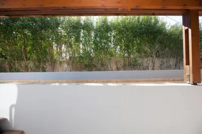 a window in a room with a fence at Natural Quiet Accommodation 2 in Kalithies