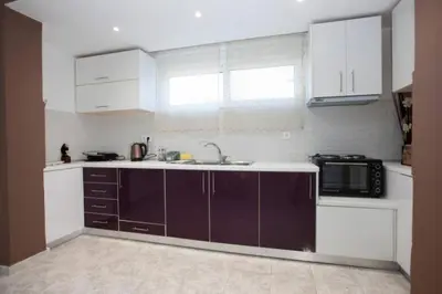 a kitchen with a sink and a microwave at Natural Quiet Accommodation 2 in Kalithies