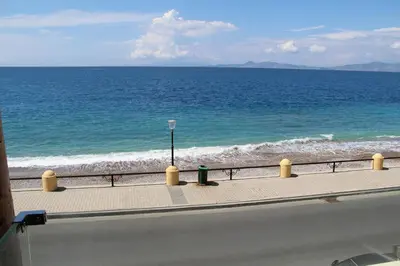 a view of the ocean from the side of a road at Sea Pearl Luxury Apartment in Rhodes Town