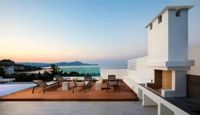 a view from the roof of a house with a fireplace at Villa Phos with swimming pool in Lindos in Líndos