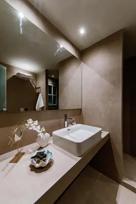 a bathroom with a sink and a mirror at Lindos Calmare Suites in Líndos