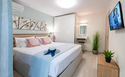 a bedroom with a bed with a hat on it at CostaMare BoutiqueApart-where luxury meets comfort in Rhodes Town